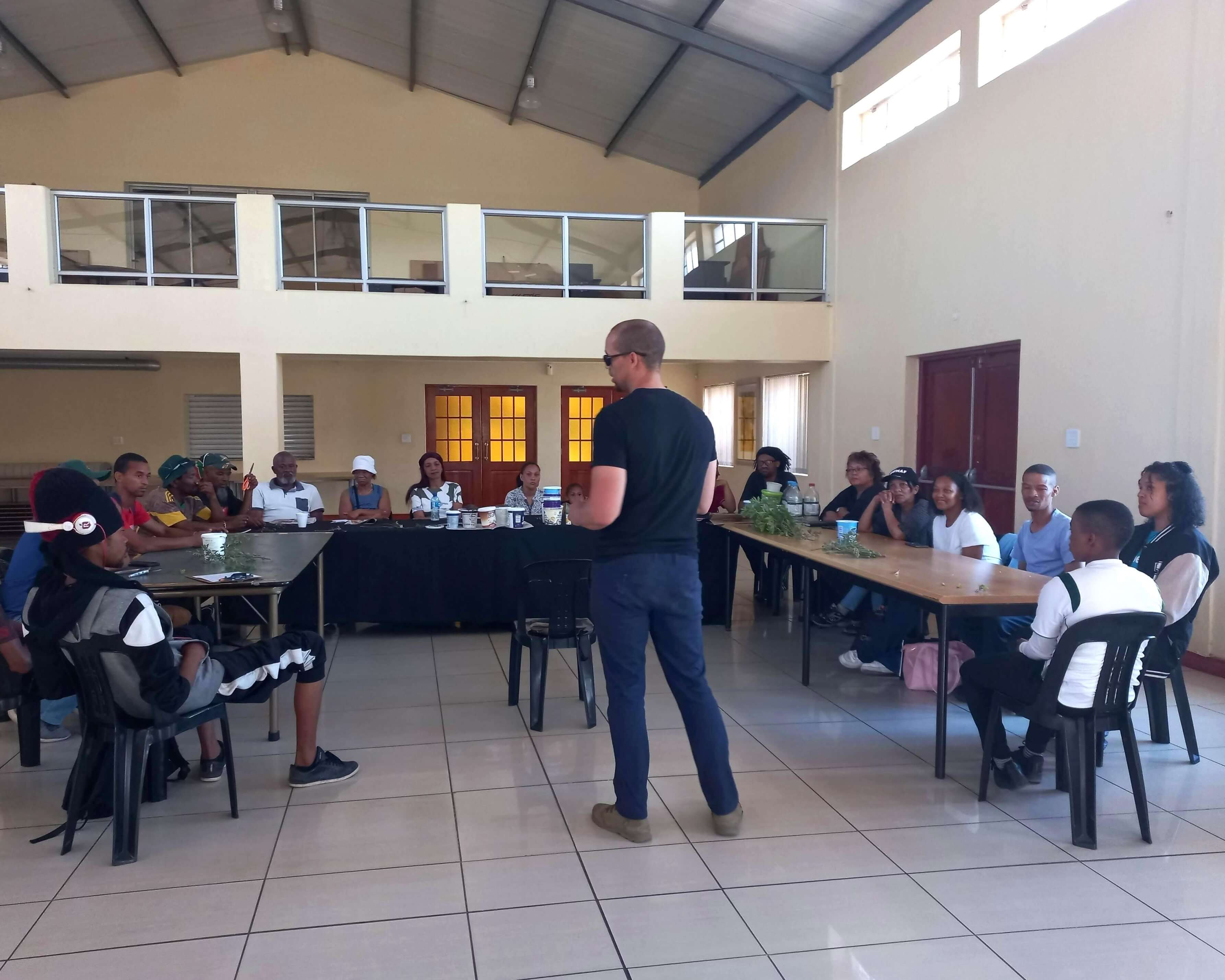 A man giving a speech to the audience
